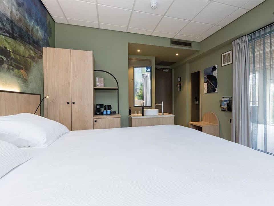 Stretch out in a spacious room with relaxing window-side seating.