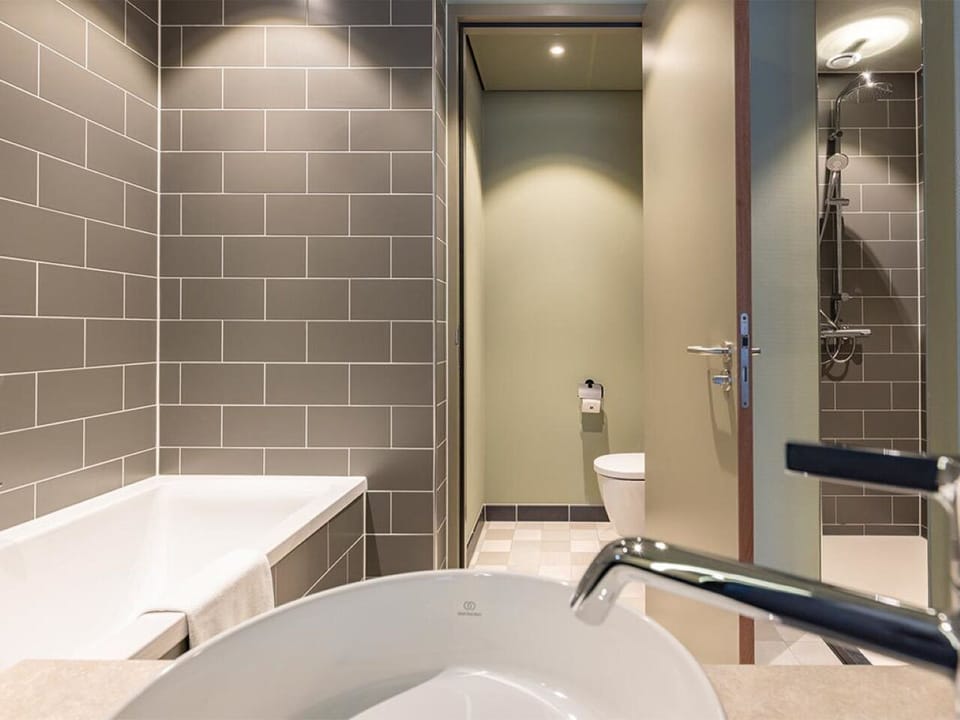 Rinse off under a rain shower after a relaxing soak.