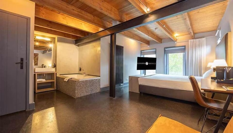 Unwind in a warm loft-style suite with spa tub.