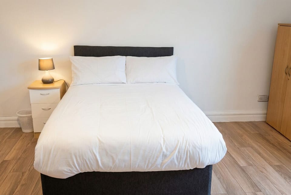 Freshly made double bed with crisp white linen so you can settle in and rest straight away.