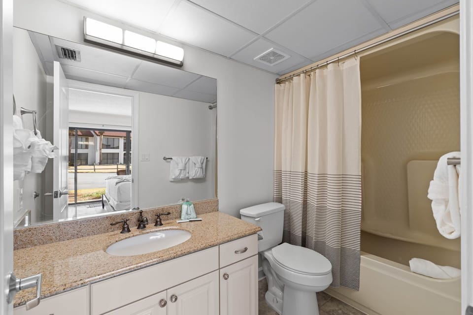 King Guest Bathroom has a vanity, and tub/shower combo
