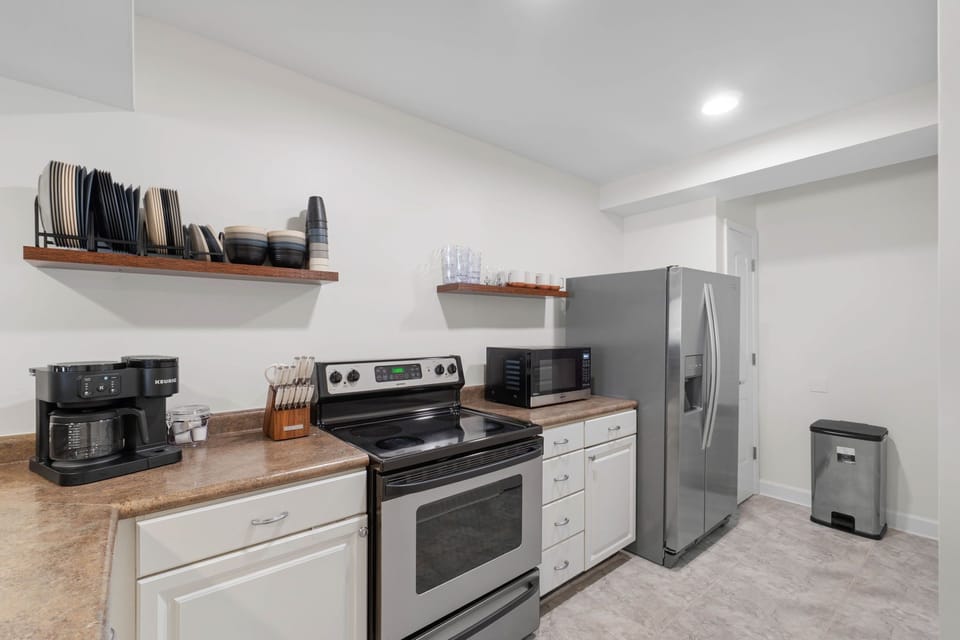 Full kitchen with Keurig, Oven, Refrigerator, Microwave and Dishwasher. Some kitchen supplies are available