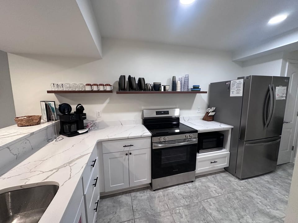 Full kitchen with Keurig, Oven, Refrigerator, Microwave and Dishwasher. Some kitchen supplies are available