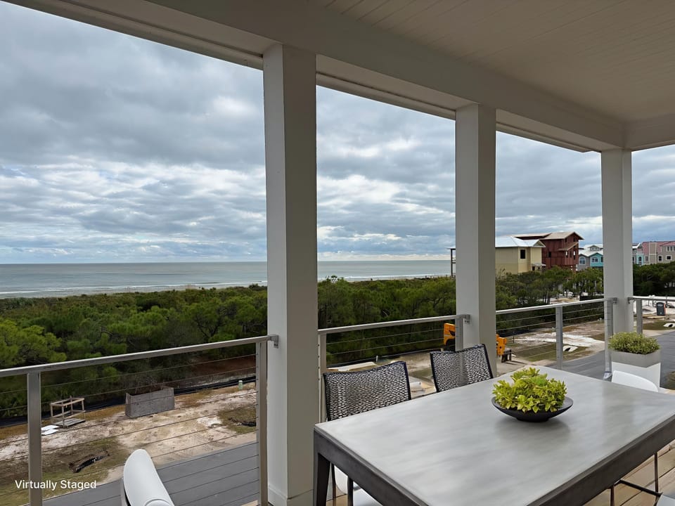 Enjoy ocean breezes and stunning sea views from your private covered balcony with dining space.