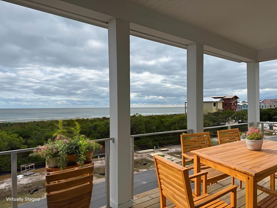 Savor morning coffee at your private dining table while enjoying sweeping ocean views and coastal breezes on this covered terrace.