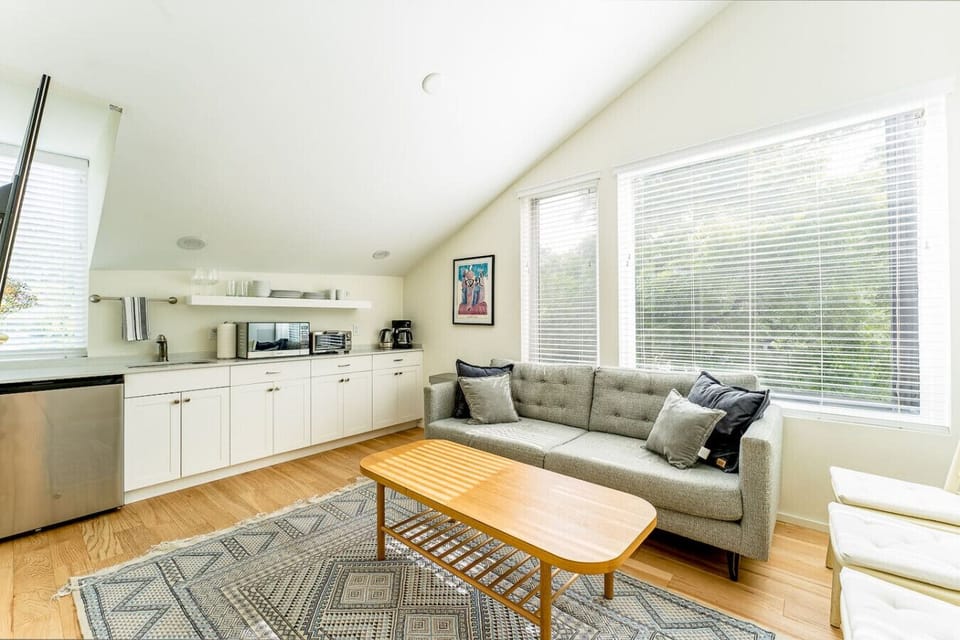 Ascend to peak chill: living room on the right, snacks in the stone kitchenette!
