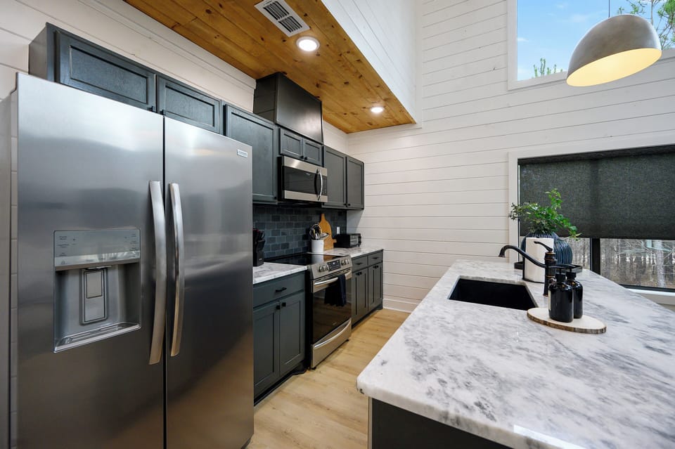 Your gourmet kitchen features modern appliances and marble countertops, perfect for creating memorable meals during your stay.
