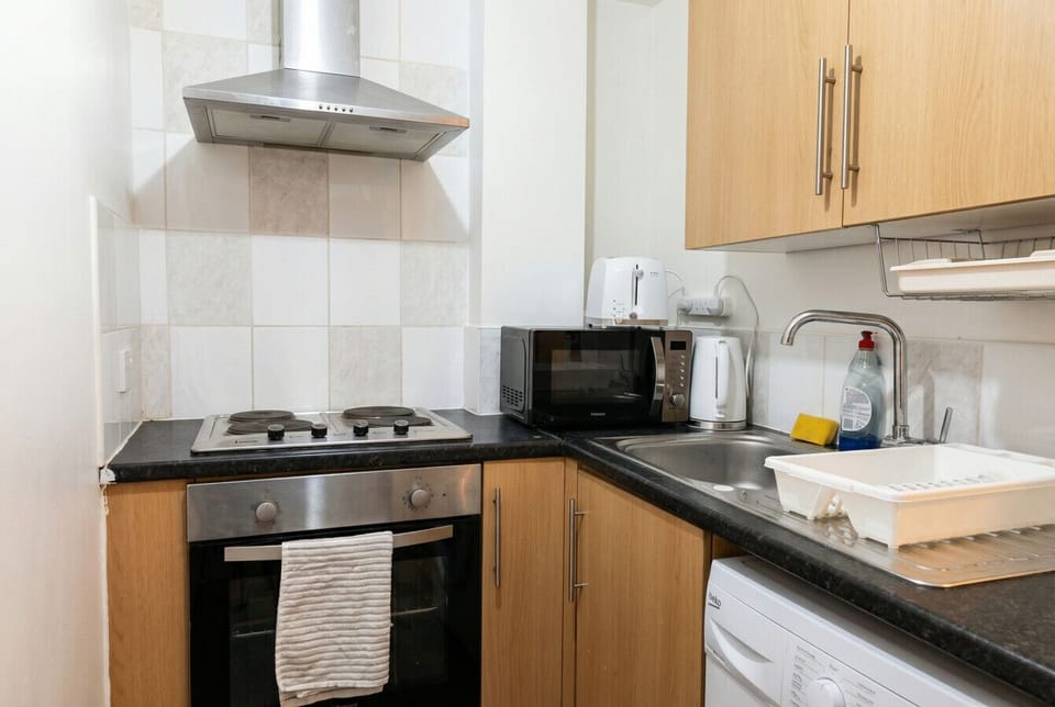 Kitchen with hob, oven, and all appliances you need to cook in.