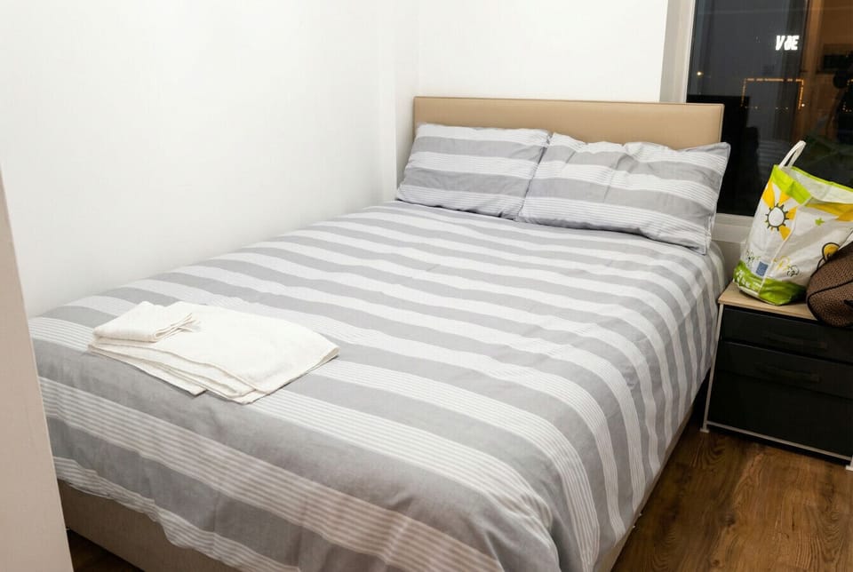 Fresh towels laid out on your double bed, ready for arrival.