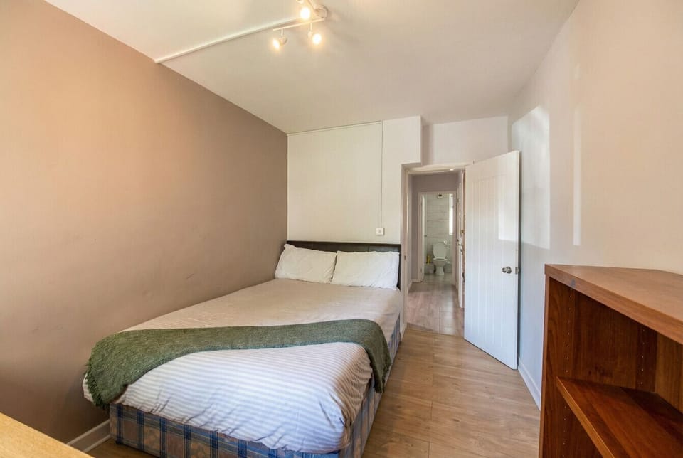 Double bedroom with built-in storage and its own private WC just steps away.