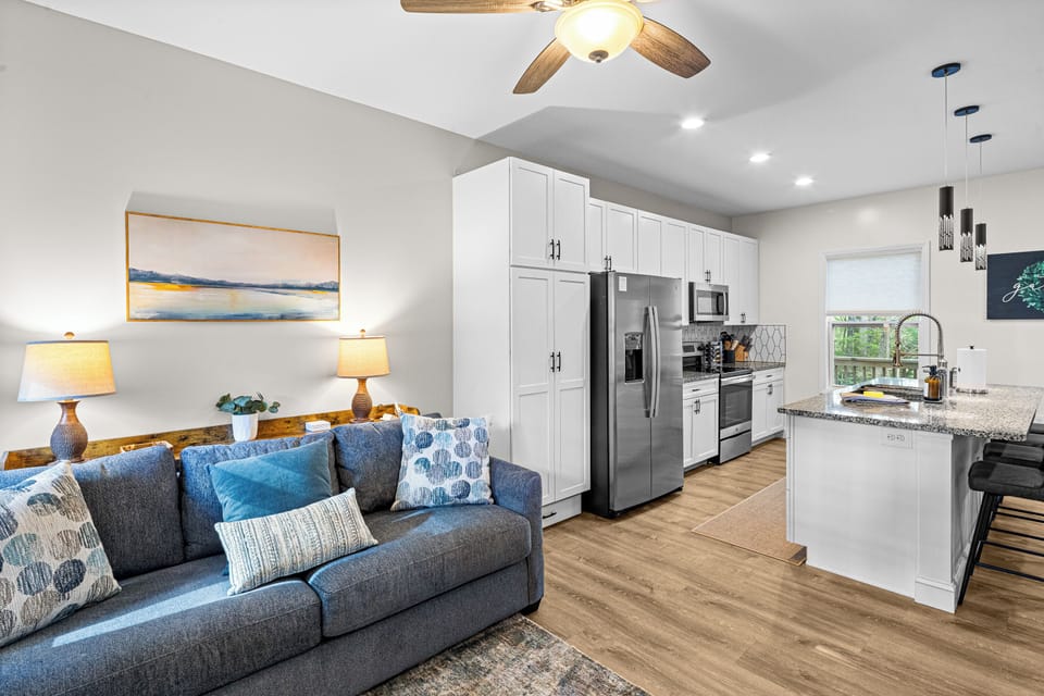 An effortless blend of style and function, this entry living space flows seamlessly into the kitchen. 