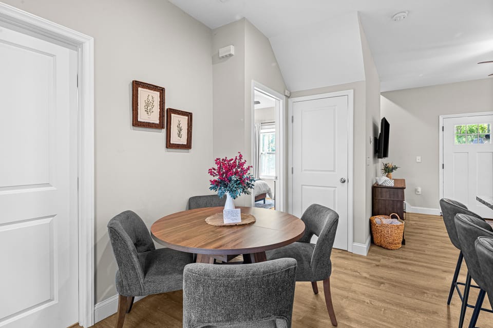 Enjoy intimate meals or lively conversation in the dining nook just steps from the kitchen. With comfortable seating and accommodations for eight, every meal becomes part of the experience.