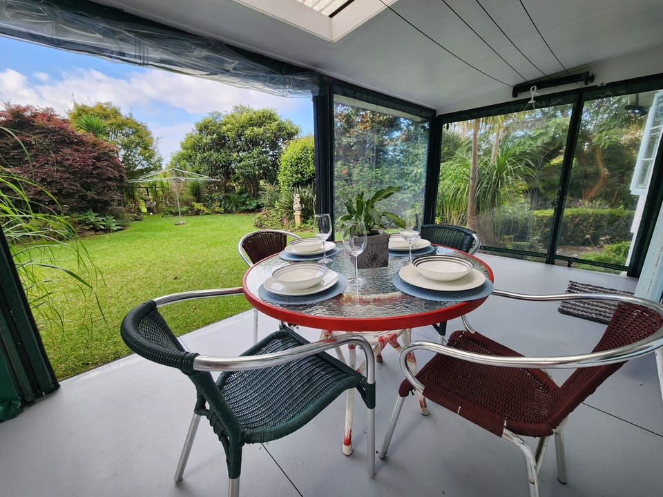 Outdoor seating on a large covered deck - a great spot to sit all year round.