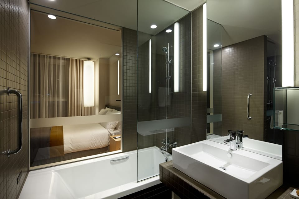 Designer toiletries, hair dryer, bathrobes, slippers