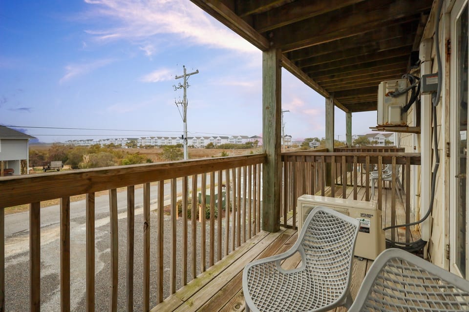 Private balcony seating with peaceful views and fresh coastal air