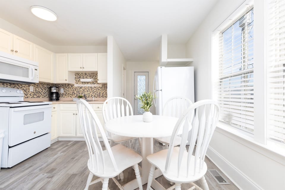 Dining nook by the window—enjoy sunny breakfasts and easy meals together