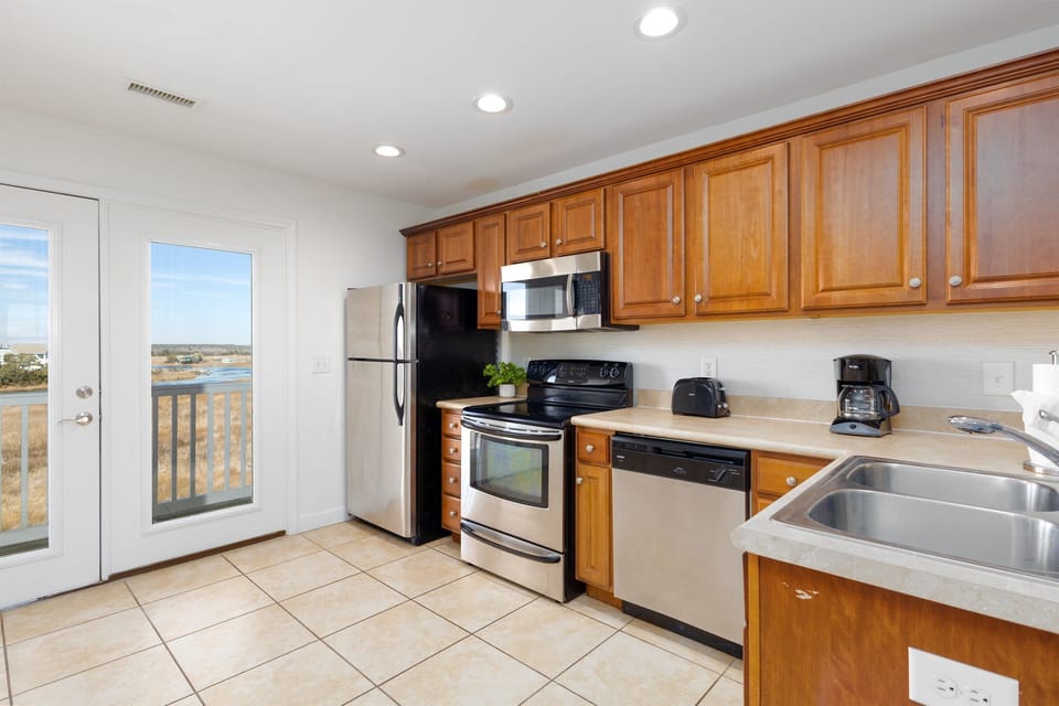 Fully equipped kitchen with modern appliances and plenty of counter space—perfect for easy meals and relaxed mornings