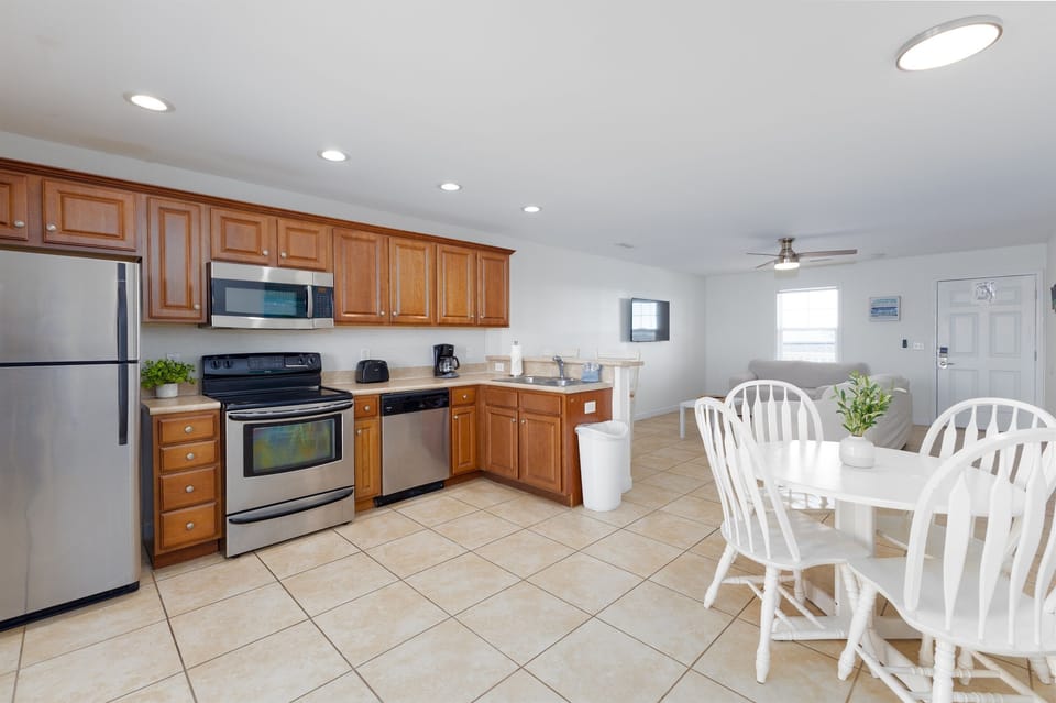 Full kitchen, dining nook, and lounge area—bright, spacious, and easy to relax in