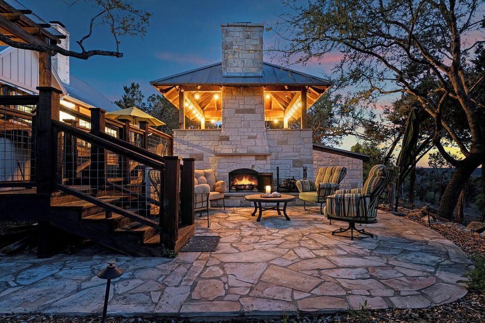 Stone fireplace, warm string lights, and the Texas Hill Country sky fading into dusk. This patio was made for the nights you never want to end good company, cool air, and nowhere else to be.