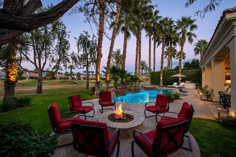 Backyard: pool and spa, natural gas fire pit with 8 chairs, natural gas fire pit, (2) sun loungers with a patio umbrella