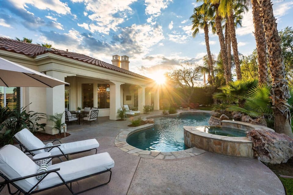 Backyard: pool and spa, natural gas fire pit with 8 chairs, natural gas fire pit, (2) sun loungers with a patio umbrella