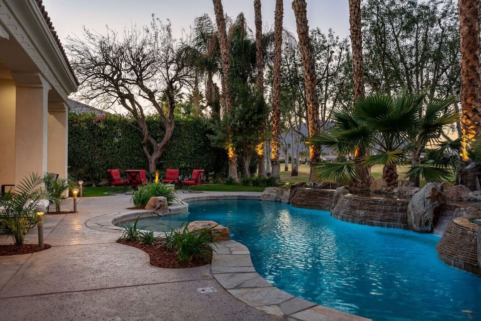 Backyard: pool and spa, natural gas fire pit with 8 chairs, natural gas fire pit, (2) sun loungers with a patio umbrella