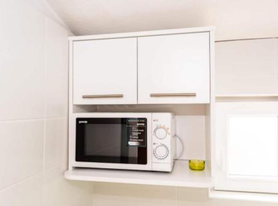 Apartment (Superior One Bedroom Apartment with S) | Private kitchen | Fridge