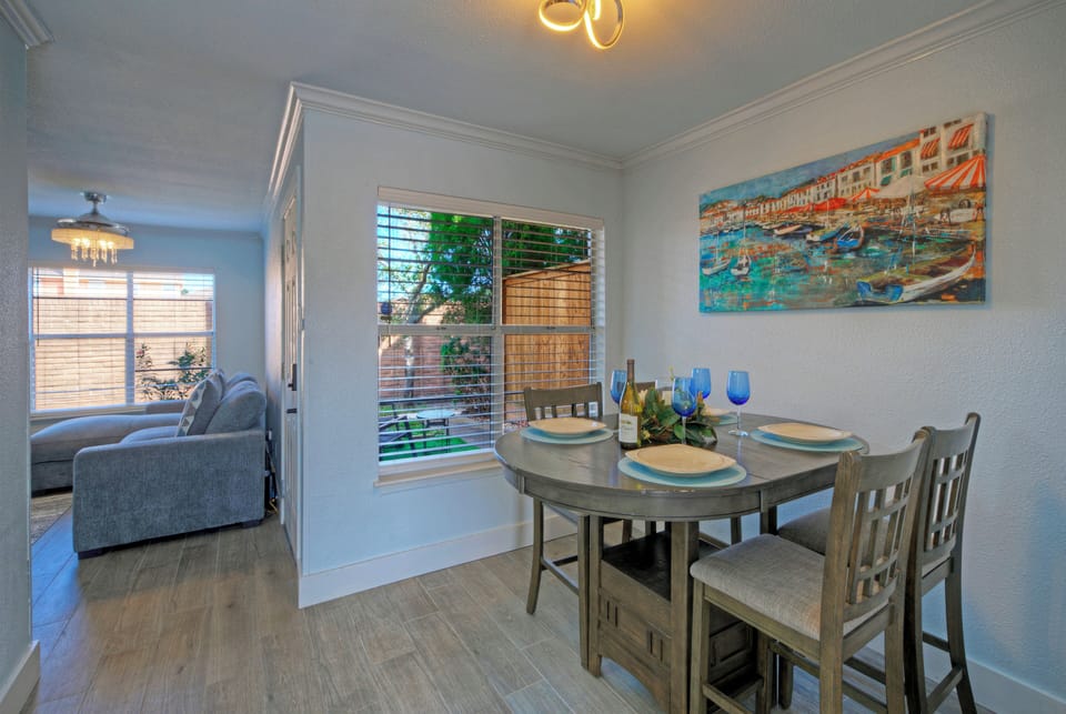 Dining nook with a view through the window to the outdoor space.