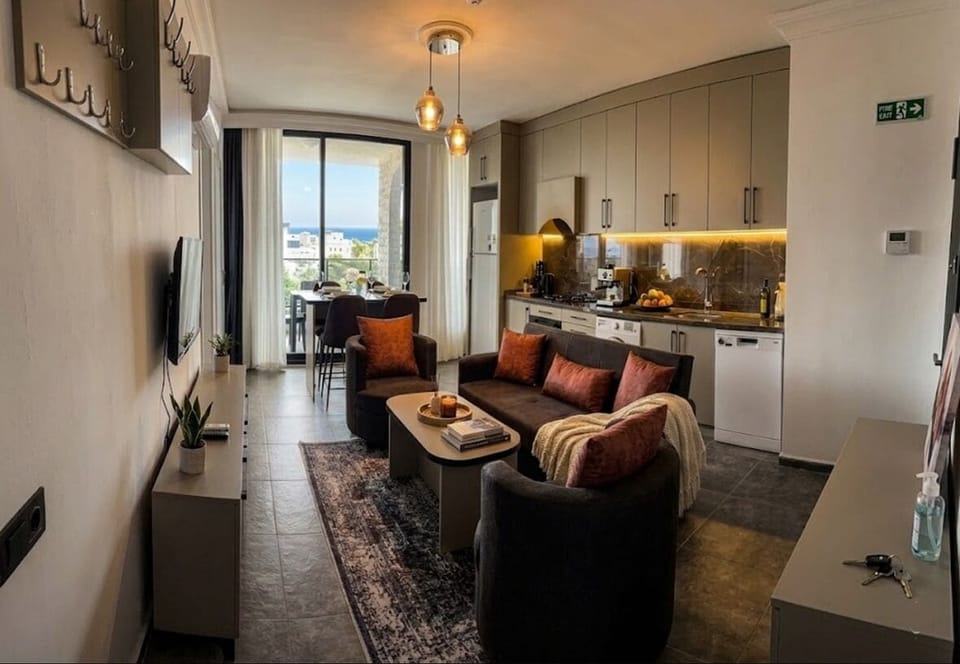 Comfort Suite, Sea View Balcony (2+1) | Living area | 32-inch Smart TV with satellite channels