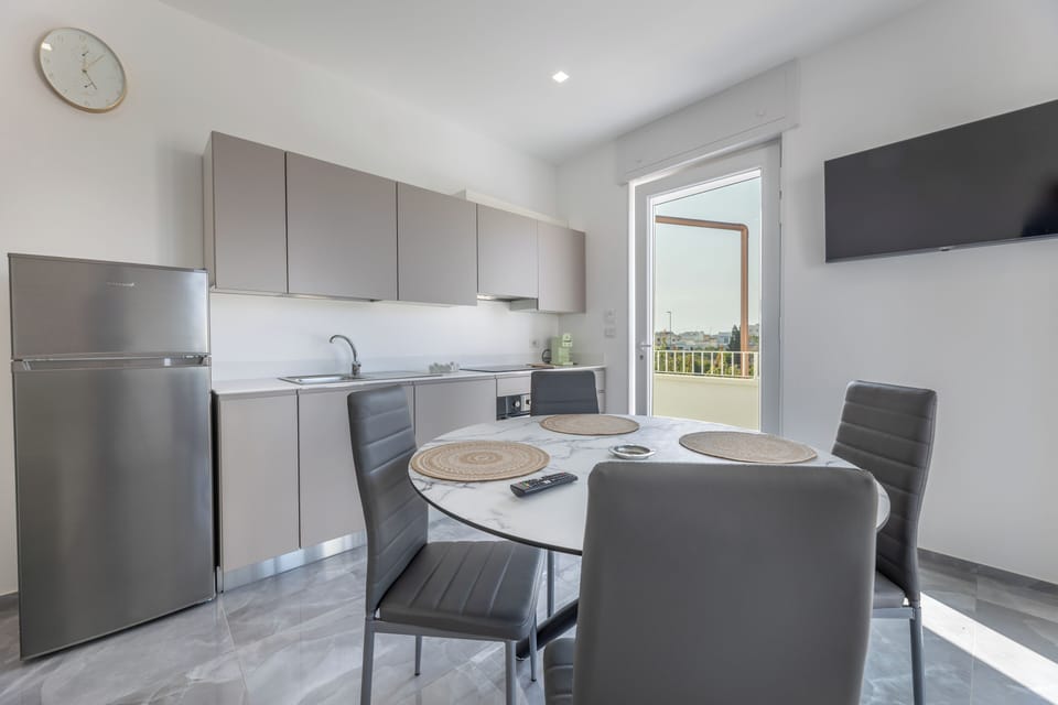 Apartment, Balcony | Private kitchen | Full-size fridge, oven, stovetop, dishwasher