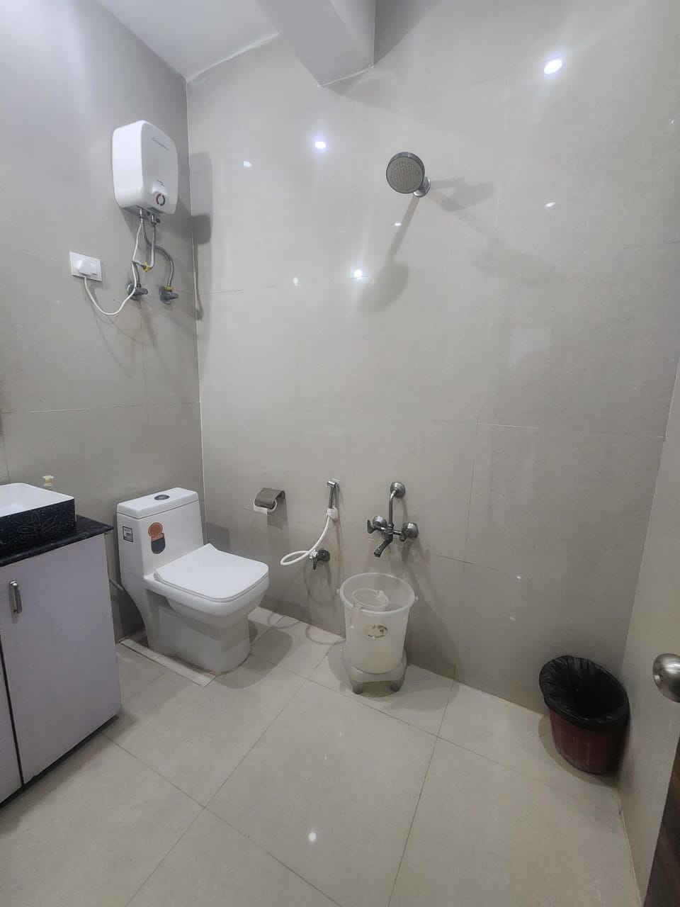 Shower, rainfall showerhead, towels, soap