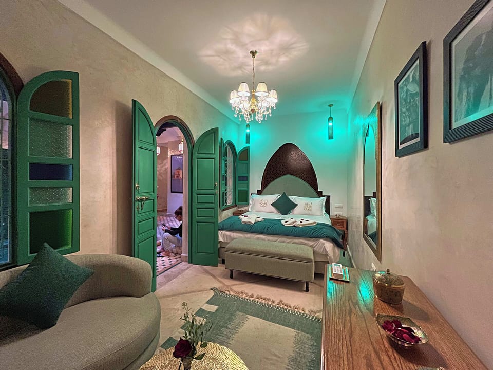 Deluxe Suite, Patio, Pool View | Premium bedding, in-room safe, iron/ironing board, free WiFi
