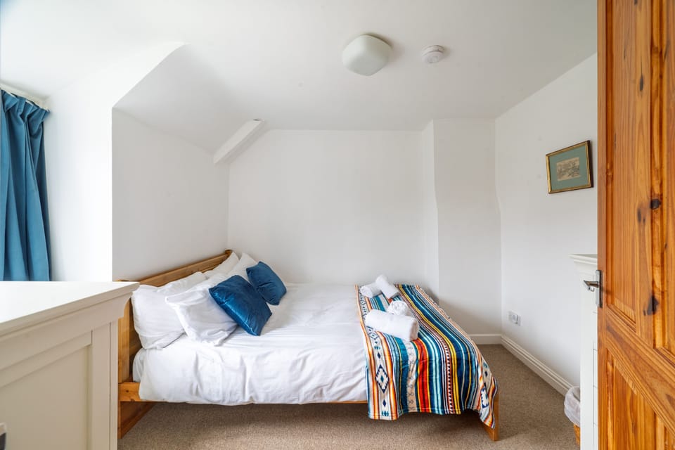 First floor: Bedroom two has a king-size bed