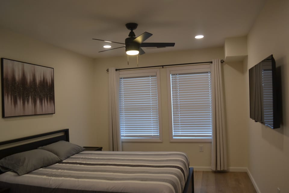 Queen bed with fresh sheets. 3 drawers on both sides of bed. Closet has hooks.