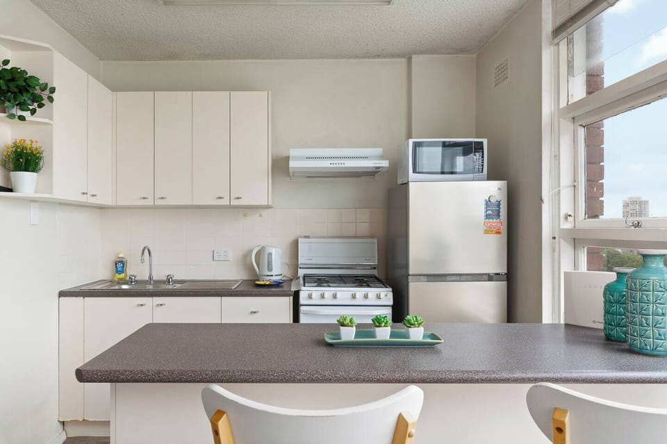 The kitchen is simple and functional, complete with all the essentials for relaxed meals at home.