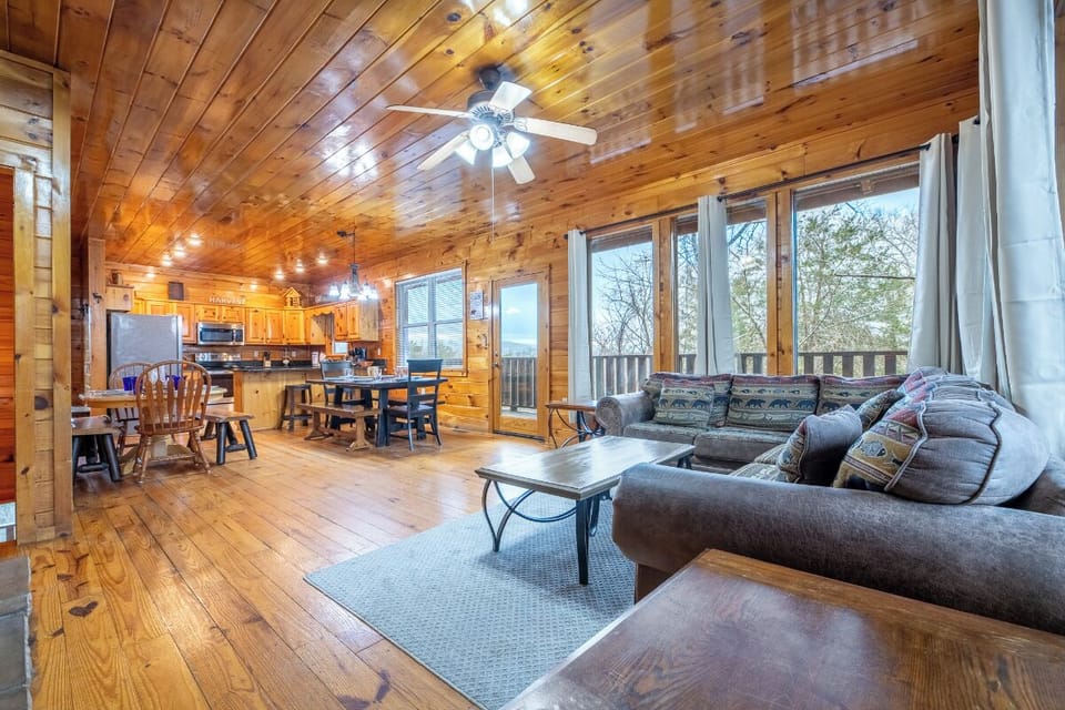 Your cozy cabin retreat features warm wood throughout, with an open living space perfect for gathering after mountain adventures.