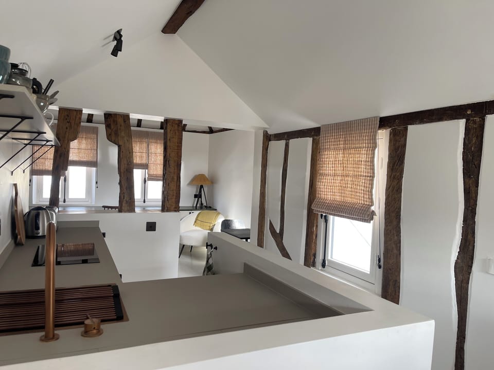 the kitchen is facing a window 