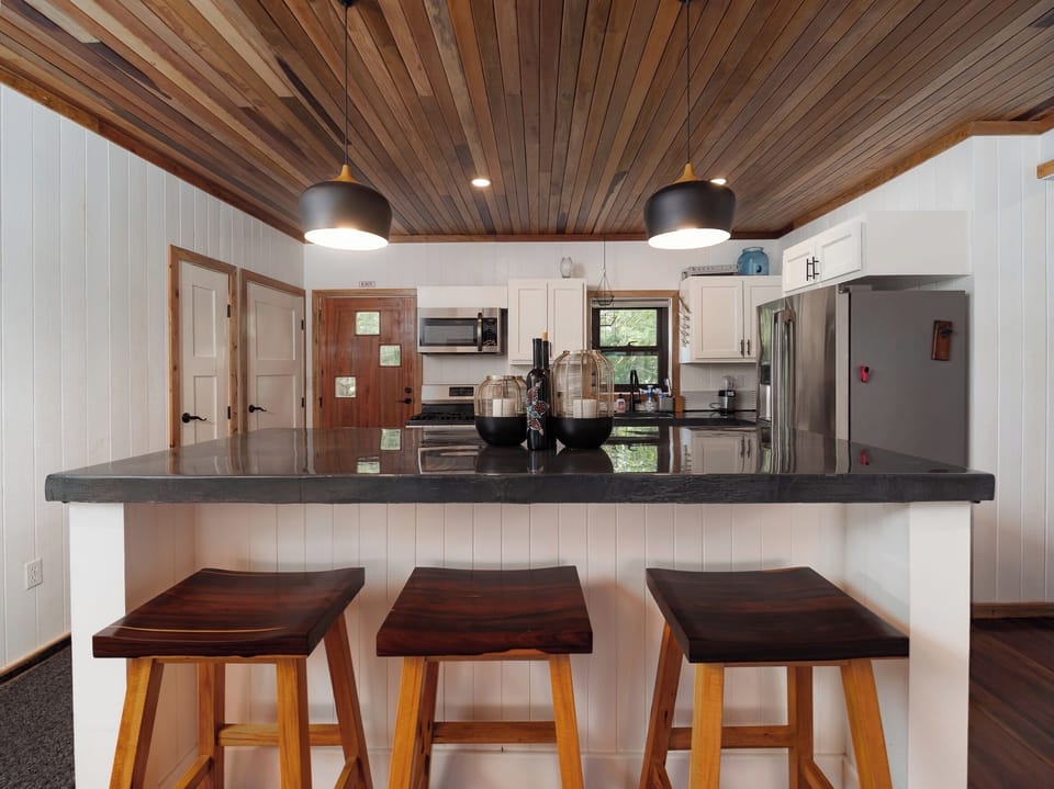 Your fully equipped kitchen features a breakfast bar where you'll start each morning.