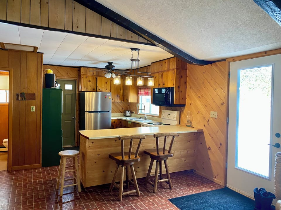 Front door and kitchen area