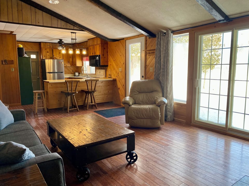Living room with view of the lake from patio doors