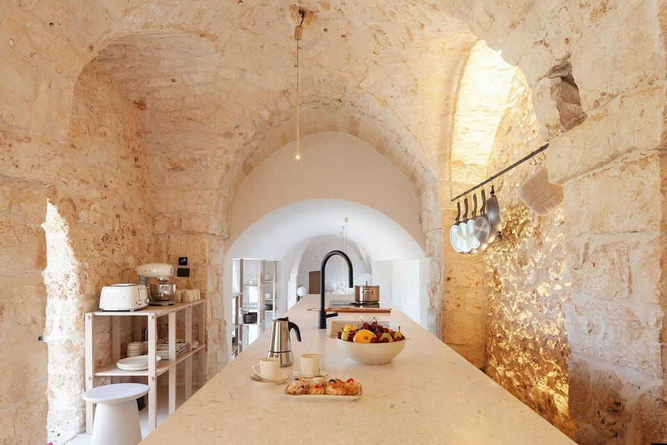 The bespoke kitchen sits proudly under its vaulted ceilings.