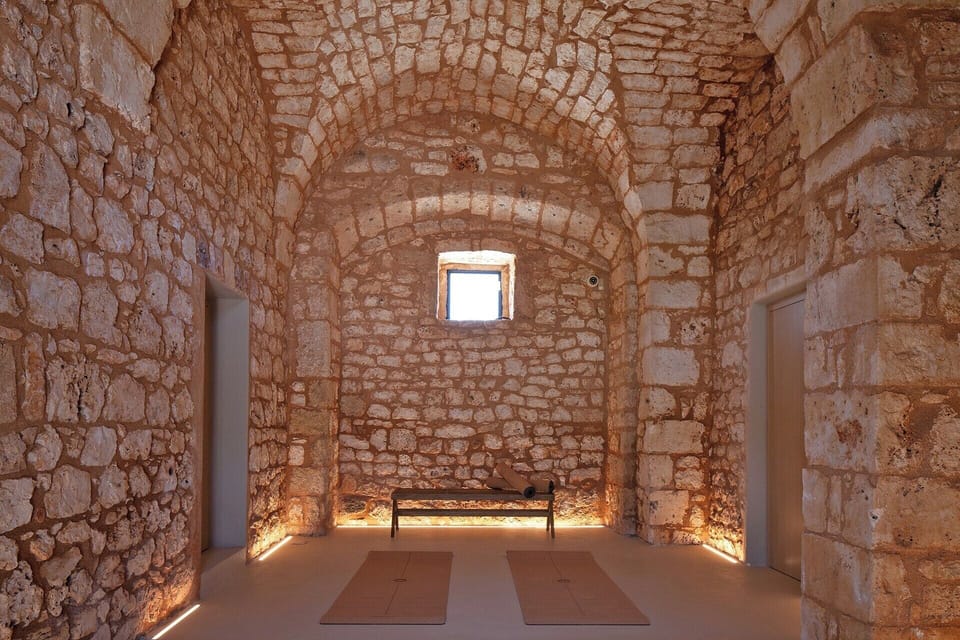 The zen-like atmosphere of the masseria's ground floor hallway and yoga area.