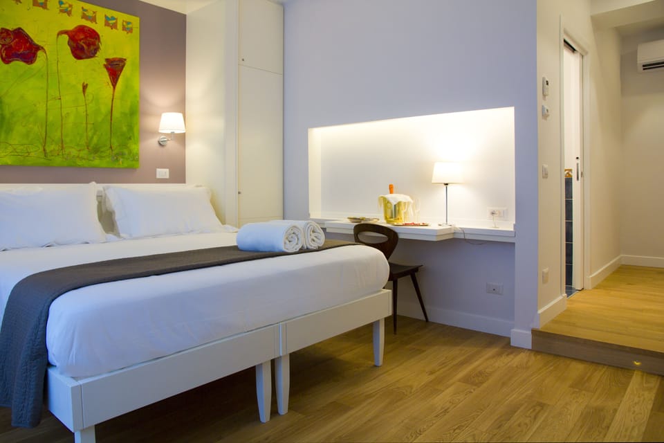 Triple Room | Minibar, in-room safe, desk, soundproofing