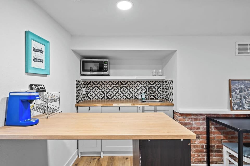 Basement apartment kitchenette with full sized refrigerator 