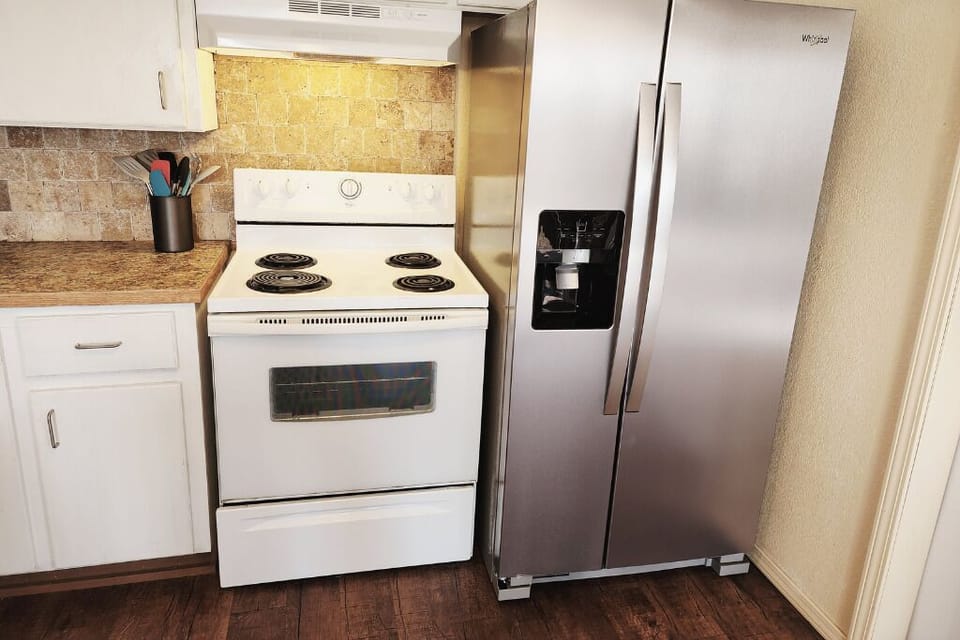 New refrigerator appliance with built-in ice maker and filtered water dispenser.