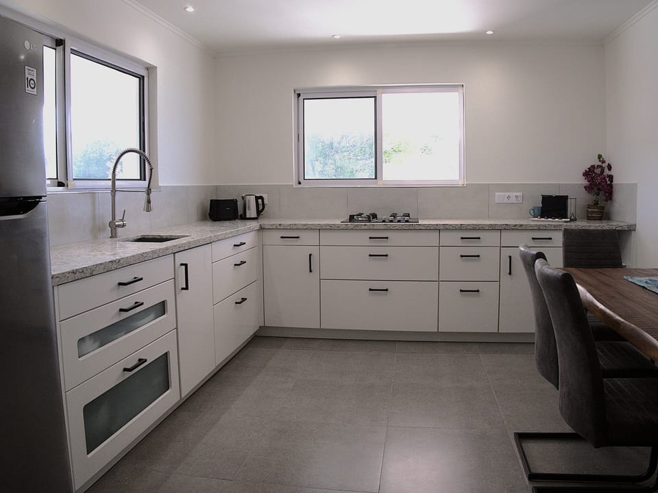 Spaceous kitchen includes indoor dining space for 4-6 guests