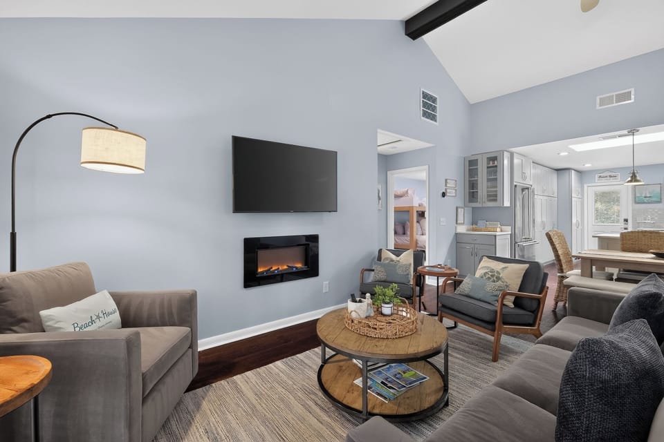 Living room opens to dining area.  Board games located in the corner cabinet. 