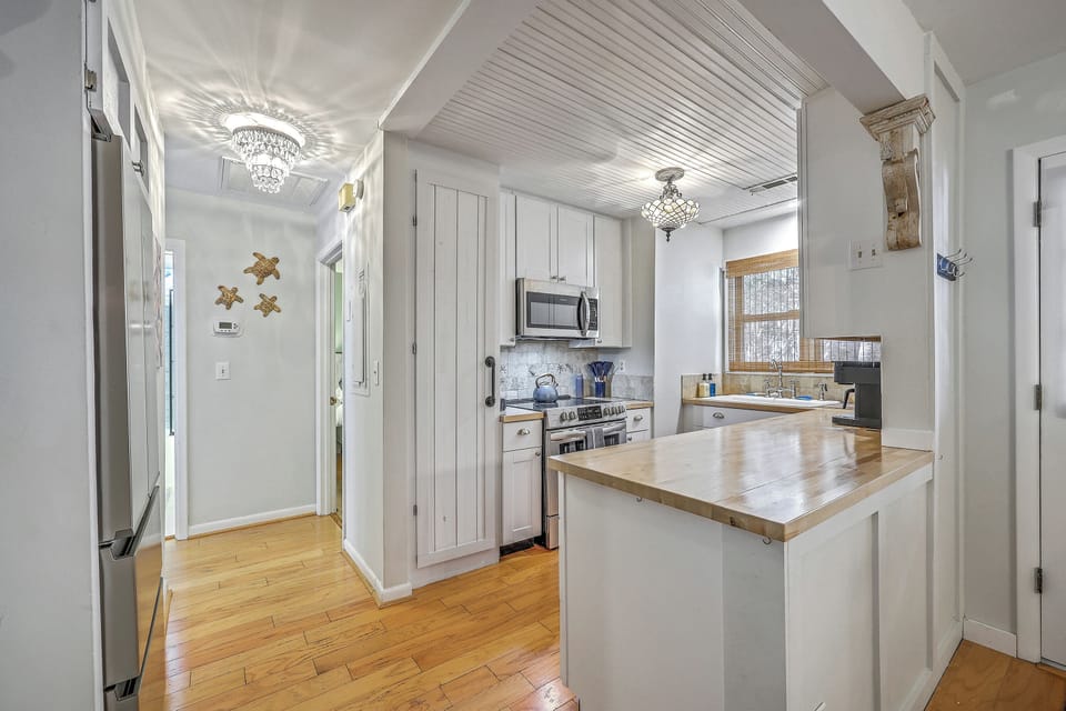 Experience an airy ambiance where natural light and coastal details welcome you home.