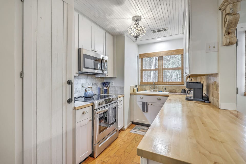 Whip up island favorites in this fully equipped kitchen, featuring sleek modern appliances for easy meal prep.