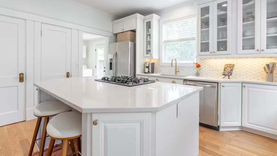 Kitchen island with stove and breakfast bar seating